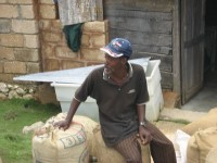 Lefay and Franklin bagging the 2008 crop as storm clouds approach the drying patio.